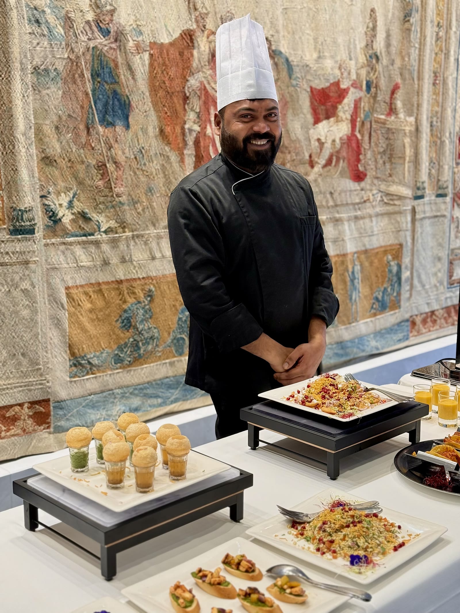 Chef Basheerkutty Mansoor in black, at a live station
